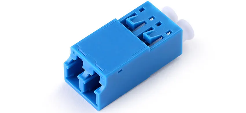 Adapter LC duplex, blue housing, white internal shutter, without flange, plastic cover